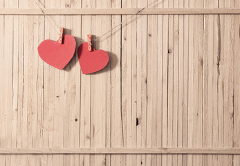 red paper heart on wooden background
