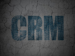 Business concept: Blue CRM on grunge textured concrete wall background