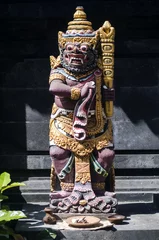 Rucksack traditional balinese hindu statues in bali temple indonesia © TravelPhotography