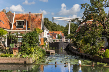 Small houses and bridge at a canal in Edam