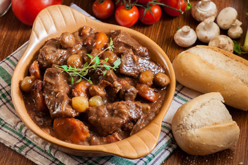 Beef Bourguignon stew served with baguette