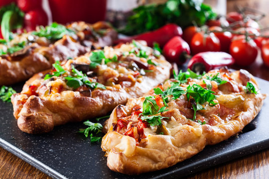 Traditional Turkish pide with meat and vegetables
