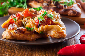 Sliced traditional Turkish pide with meat and vegetables