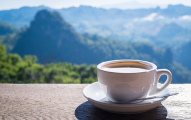 Coffee in White Cup and Mountain View