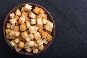 Crispy croutons in bowl