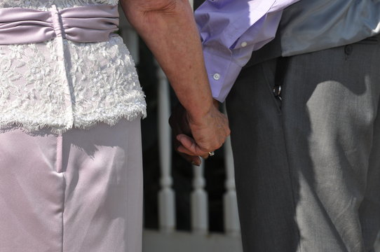 Older Couple Getting Married Holding Hands