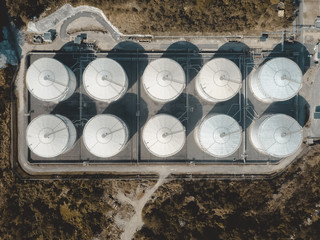 drone view of storage tank in the forest