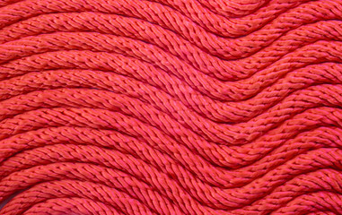 Close up pattern of red rope lines.