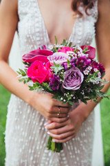 Obraz na płótnie Canvas wedding bouquet in hands of the bride
