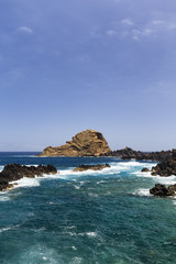Fototapeta na wymiar Portrait view of clear waters in Porto Moniz, Madeira, Portugal.