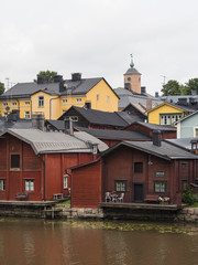 Fototapeta na wymiar Old red wooden barns in the city of Porvoo in Finland.