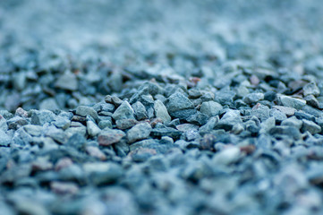 a chovel in a pile of grey gravel