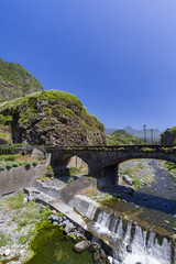 Fototapeta na wymiar Portrait view of a bridge in the small village of Sao Vicente on the island of Madeira, Portugal.