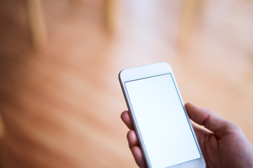 Mockup image of smartphone with blank white screen.