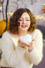 Pretty teen girl is holding artificial snowball