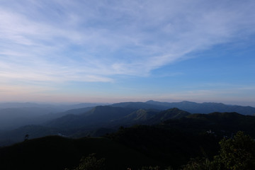 Fototapeta premium Beautiful mountain landscape, with mountain peaks covered with forest and a cloudy sky