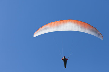 Man practicing paragliding extreme sport
