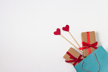 Hearts on stick, two gifts, gift bag, hearts on a white background