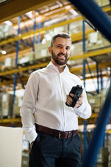Warehouse worker or supervisor with barcode scanner. © Halfpoint