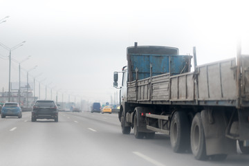 truck on the road with empty trailer