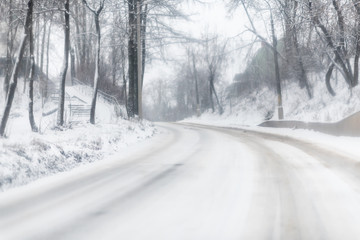 Fototapeta premium winter road covered by snow