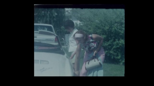 1966 Young couple drives off in vintage Karmann Ghia