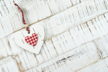 Heart of wood on wooden background, copy space
