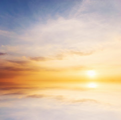 Background sky during sunset and water reflections.