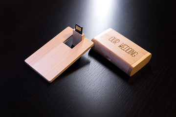 wooden usb flash drive on a black table