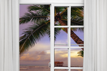 view from the open window of the caribbean sunset