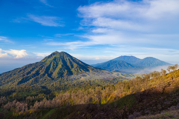 Fototapeta na wymiar Landscape view of big mountains at Kawah Ijen volcano. Ijen volcano the famous tourist attraction near Banyuwangi, East Java, Indonesia