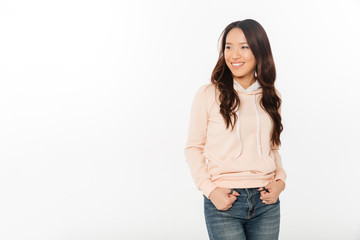 Fototapeta premium Asian cheerful lady standing isolated
