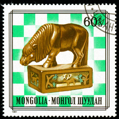 Ukraine - circa 2018: A postage stamp printed in Mongolia shows drawing Mongolian chess figures Series: Costumes. Circa 1981.