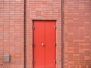 Steel Red Door on Red Brick Wall