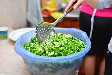 Closeup of Human hands cooking vegetables salad in kitchen