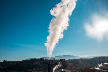 Smoke chimney from a factory. Concept of pollution
