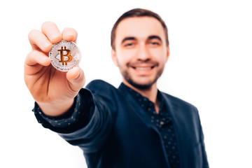 Handsome smile man in suit pointed silver bitcoin on white background