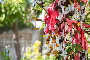 Dry flower garland hanging on the tree.