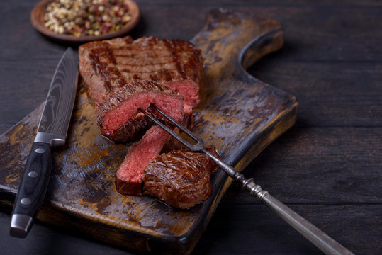 Closeup slice steak on board