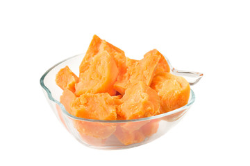 Yellow potato in glass bowl isolated on white background