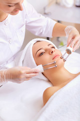 Woman on facial skincare procedure.
Hardware cosmetology.
