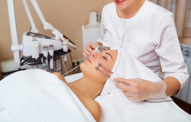 Woman on facial skincare procedure.Hardware cosmetology.