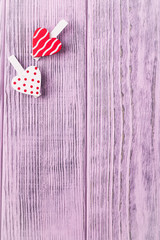 Happy Valentine's Day. Valentine's day background. Two hearts with clothespins on a pink background. Top view, free space