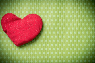 Valentines Day. Colorful knitted hearts on a vintage background in polka dots. Red heart. Green...