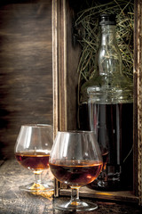 bottle of cognac in an old box.