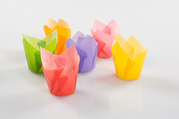Brightly colored paper baking cups for cupcakes or muffins