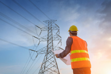 Engineering working on high-voltage tower