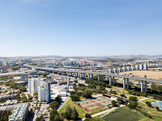 Fototapeta premium Aerial View Of Vasco da Gama Bridge And High Car Traffic In Lisbon City Of Portugal