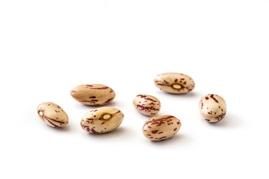 Raw pinto beans isolated on white background

