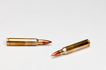 A pair of isolated 223 cartriges on a white background